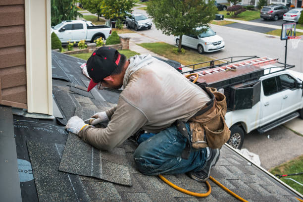 Professional Storm Damage Roof Repair technician working in Columbia, CT